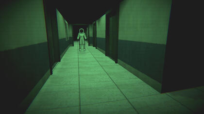 A screenshot from the game Moon's Haunted. The main character, Tom Spaceman, stands at the entrance of a long hallway. The camera is at the other end, facing him, emphasizing his isolation.